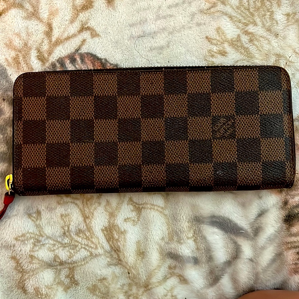 Brown Louis Vuitton wallet with red inside